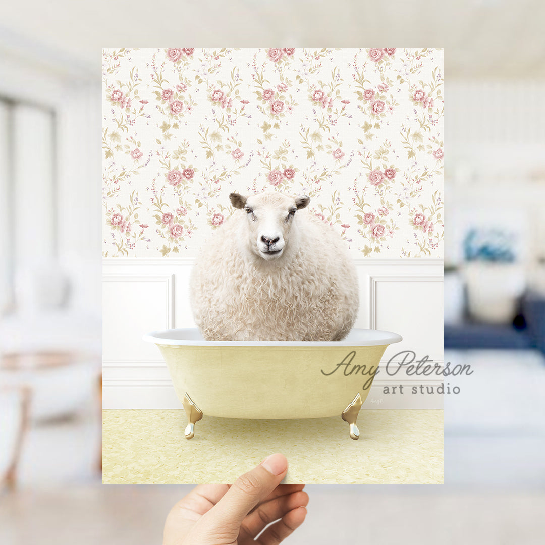 a hand holding a card with a sheep in a bathtub