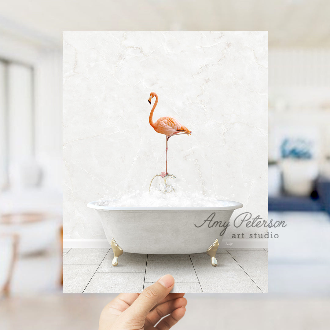 a person holding up a picture of a flamingo in a bathtub