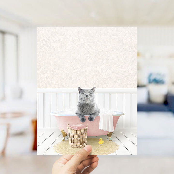 A gray cat sitting in a pink bathtub, with a yellow rubber duck nearby, in a cozy, homely setting.