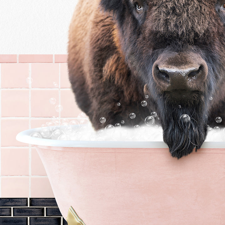 a large buffalo standing in a bathtub filled with bubbles