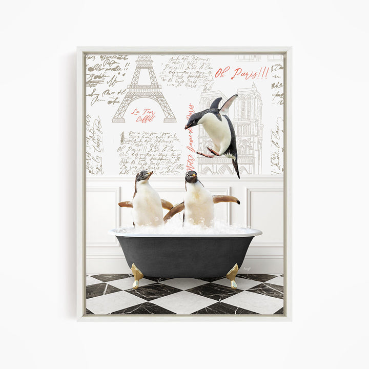 A framed image depicting three penguins sitting in a bathtub, with one penguin flying above the tub and the other two penguins sitting in the water.