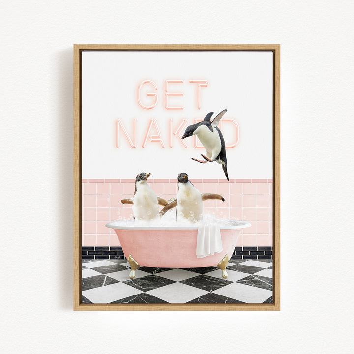 A framed image depicting three penguins sitting in a pink bathtub, with a neon sign above them that says "GET NAKED".