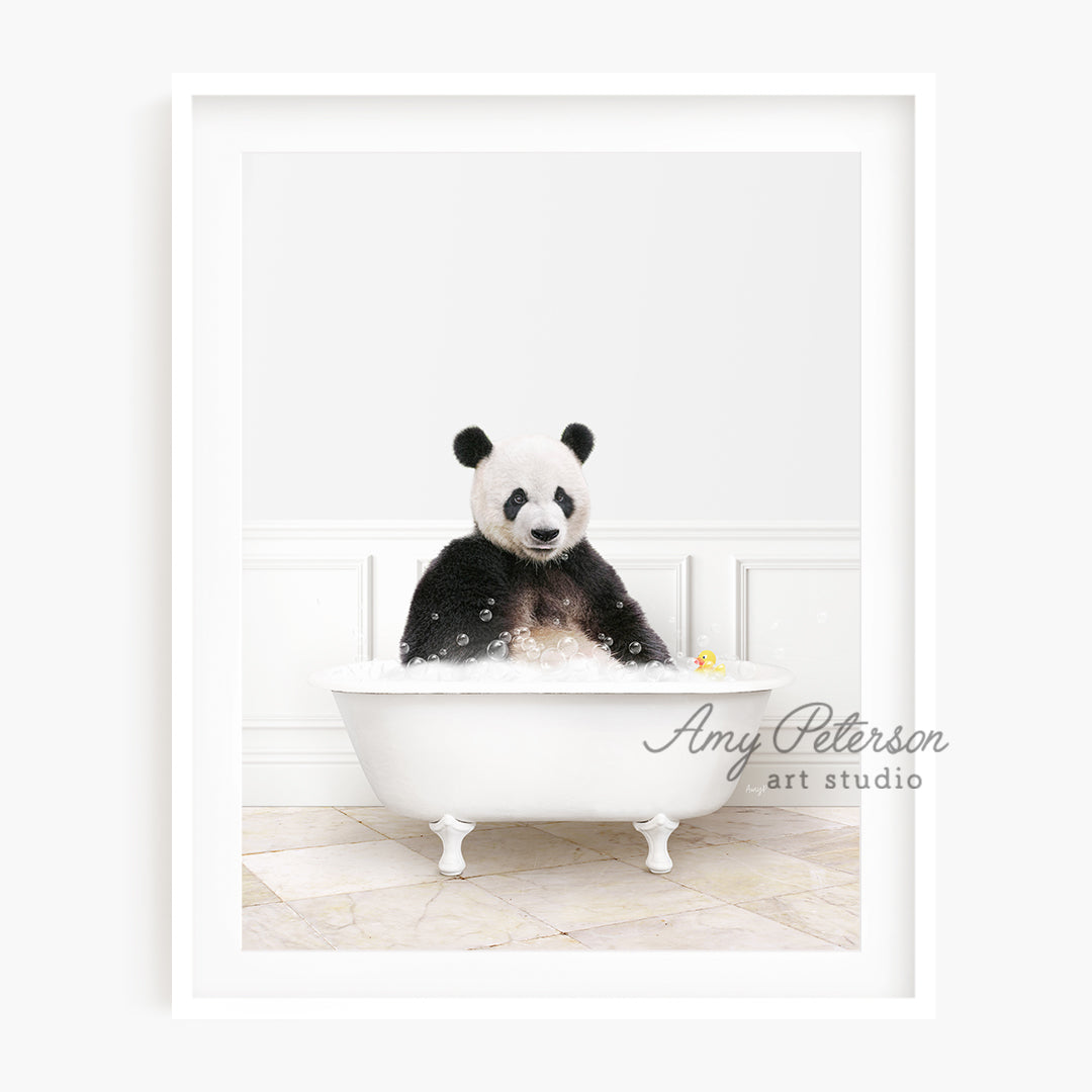 a stuffed panda bear sitting in a bathtub