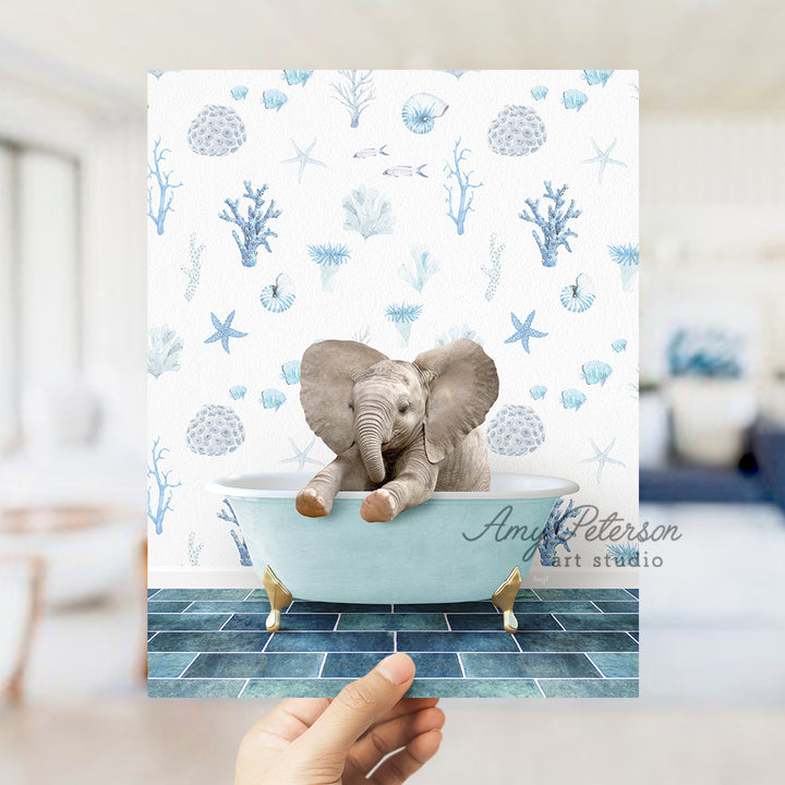 a person holding up a card with an elephant in a bathtub