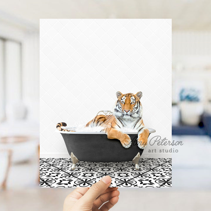 a hand holding up a card with a picture of a tiger in a bathtub