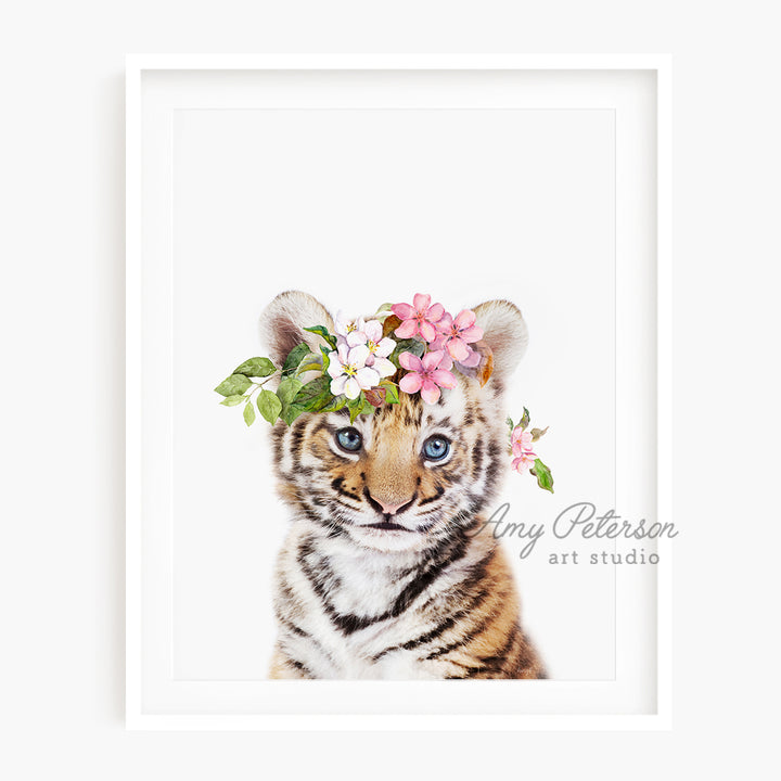 a tiger cub with a flower crown on its head