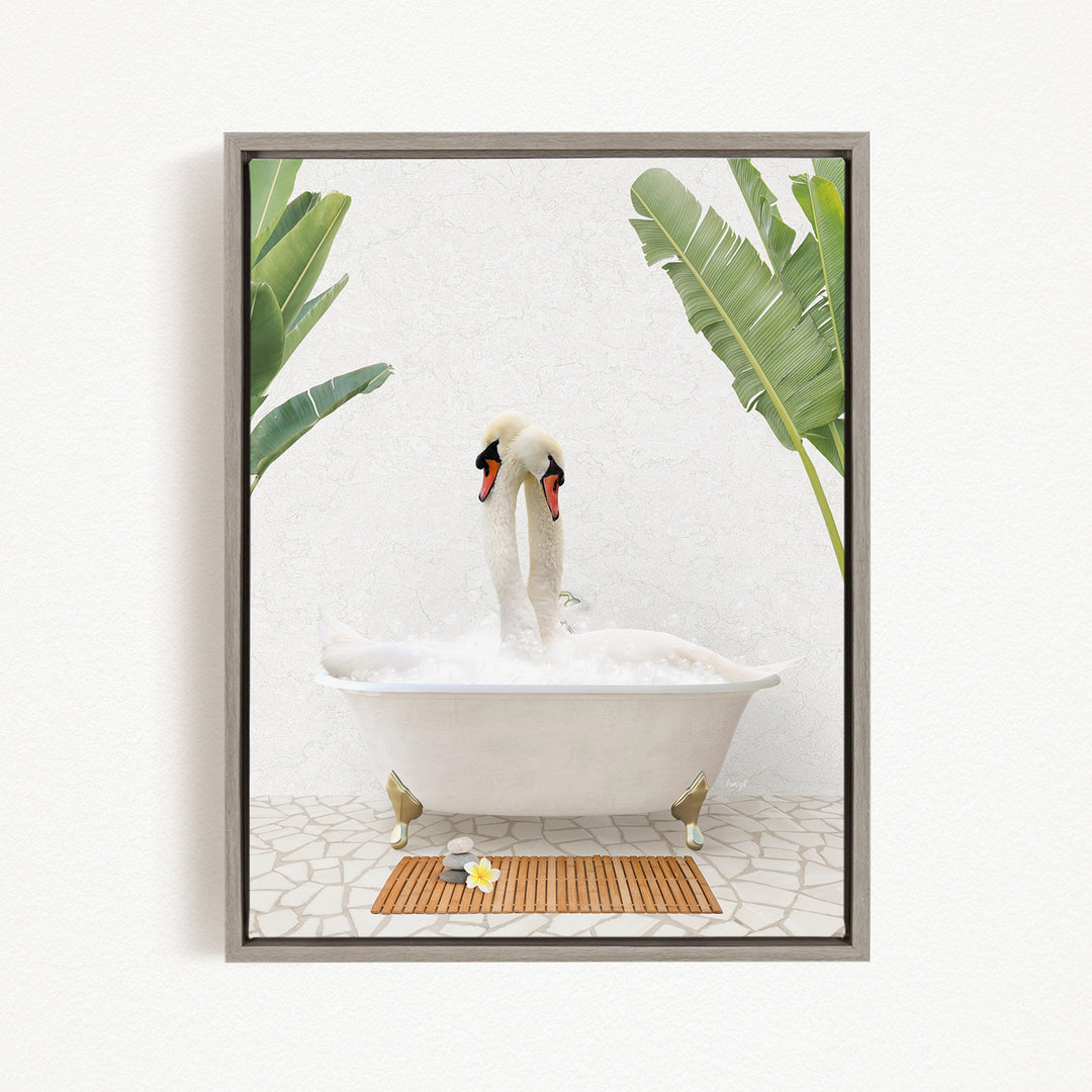 A pair of swans sitting in a white bathtub, surrounded by green leaves, creating a serene and relaxing scene.