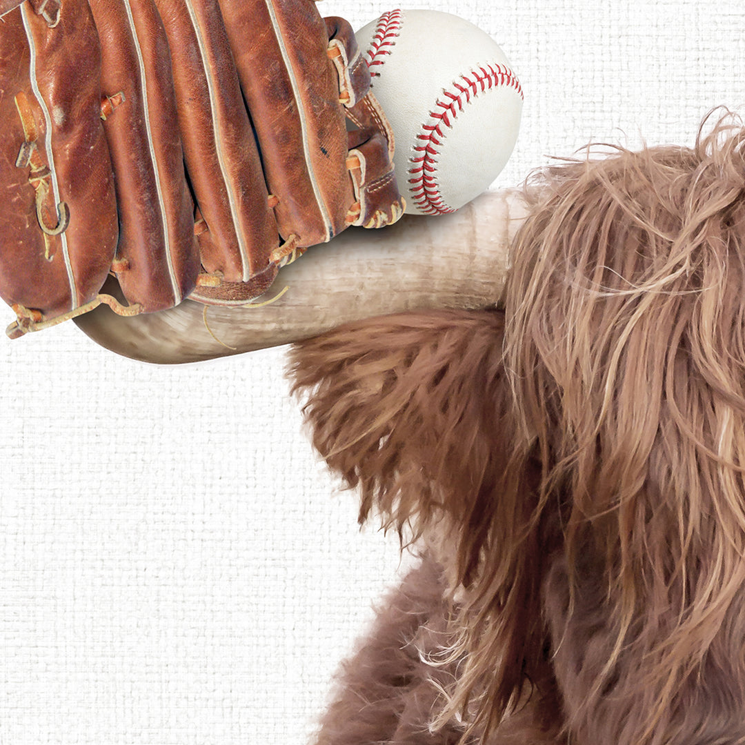 a dog with a baseball glove and ball in it's mouth