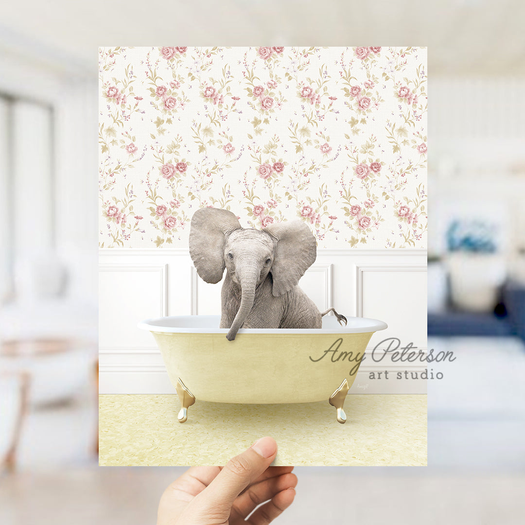 a person holding up a card with an elephant in a bathtub