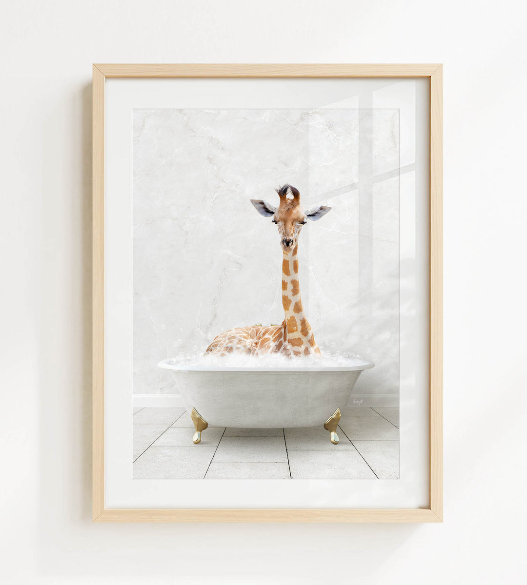 A giraffe is sitting in a white bathtub filled with bubbles, creating a whimsical and playful scene.