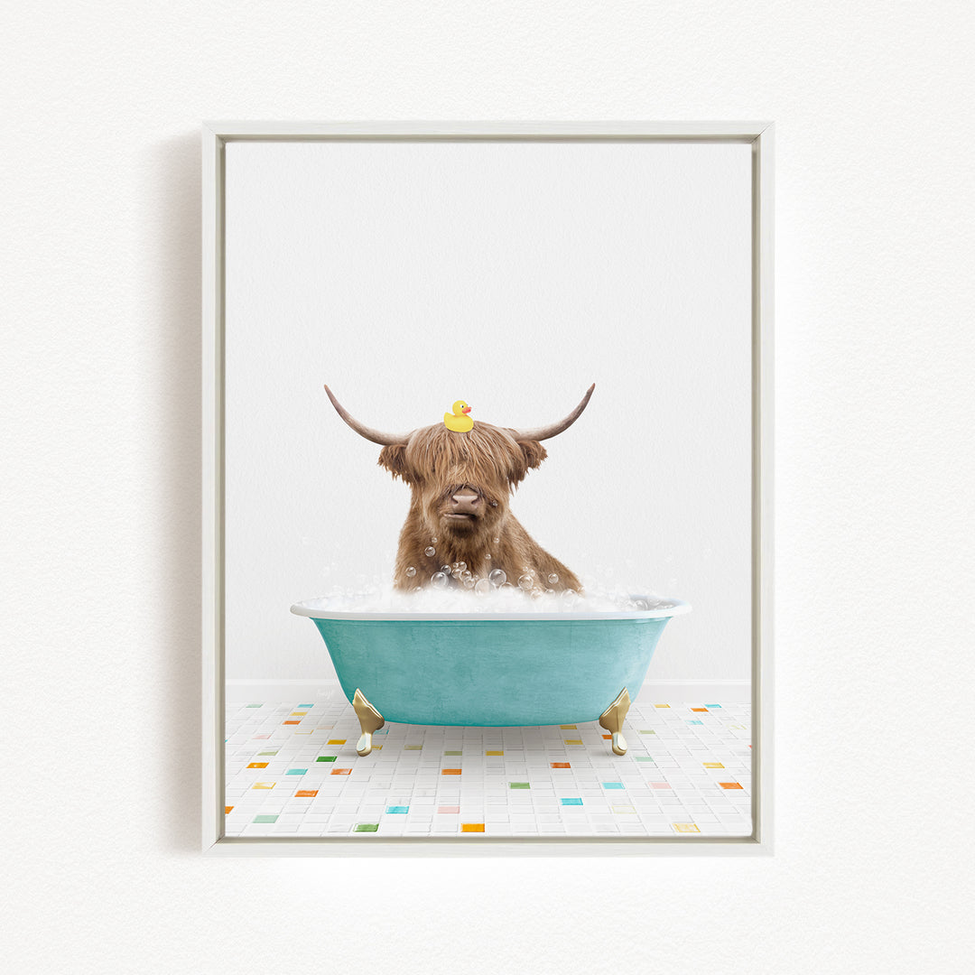 A brown cow with long horns is sitting in a blue bathtub filled with bubbles, with a rubber duck perched on its head.