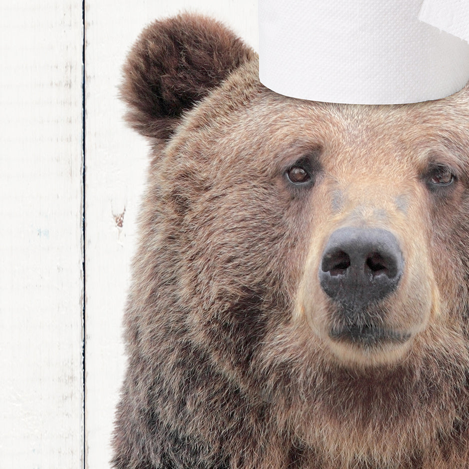 a brown bear with a paper hat on its head