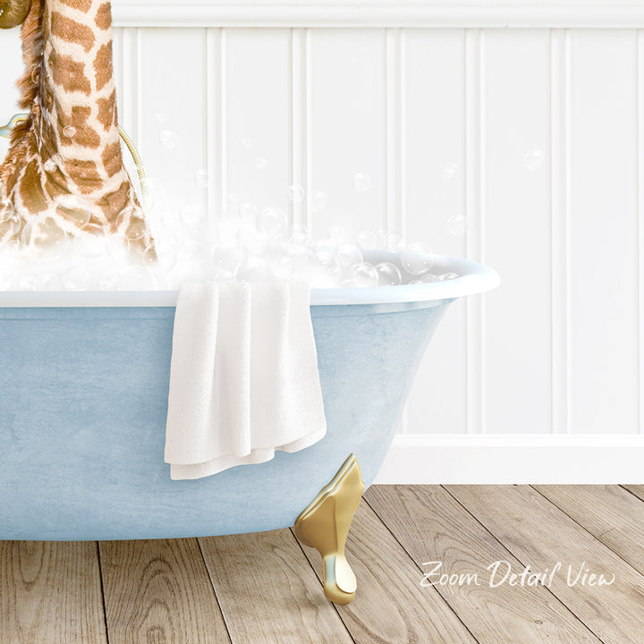 A blue claw-foot bathtub filled with bubbles, with a towel hanging on the side and a giraffe standing next to it.