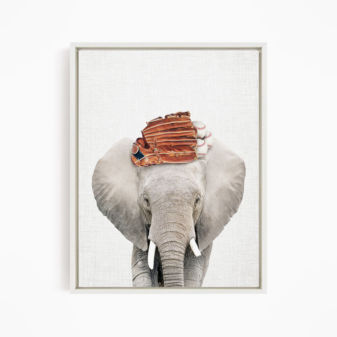 A gray elephant with a baseball glove on its head, standing against a white background.