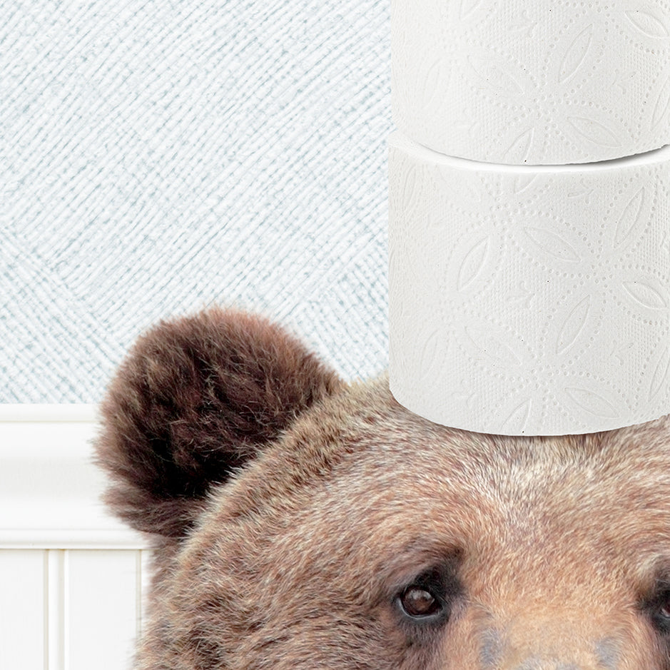 a close up of a bear with a toilet paper on its head