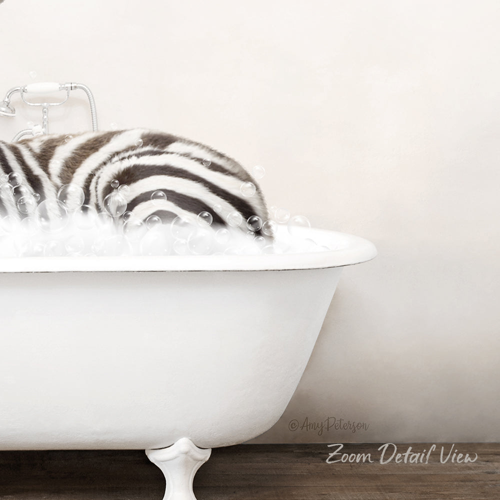 A zebra lying in a white bathtub filled with bubbles, creating a whimsical and playful scene.