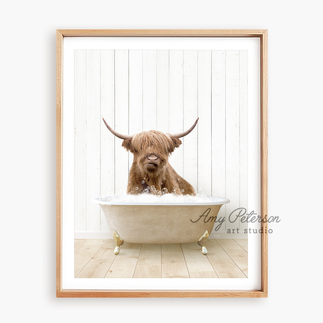 a framed photograph of a dog in a bathtub