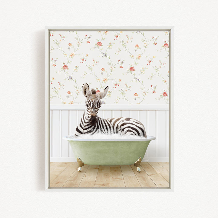 A zebra is sitting in a green bathtub, surrounded by a floral wallpaper.