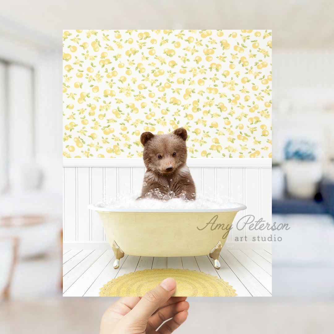 a person holding up a picture of a teddy bear in a bathtub