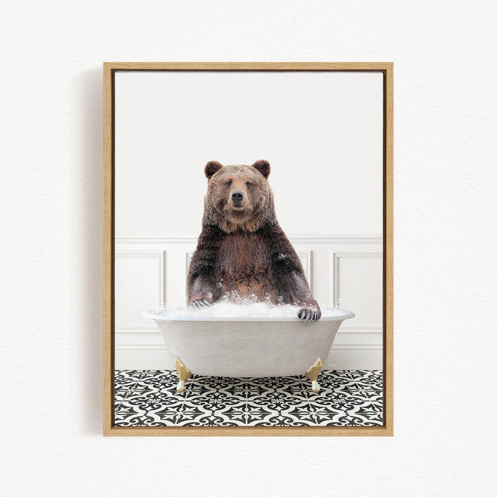 A brown bear sitting in a white bathtub filled with bubbles, creating a whimsical and playful scene.