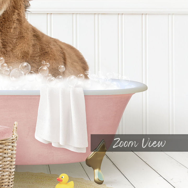 A dog is sitting in a pink bathtub filled with bubbles, surrounded by a yellow rubber duck and a white towel.