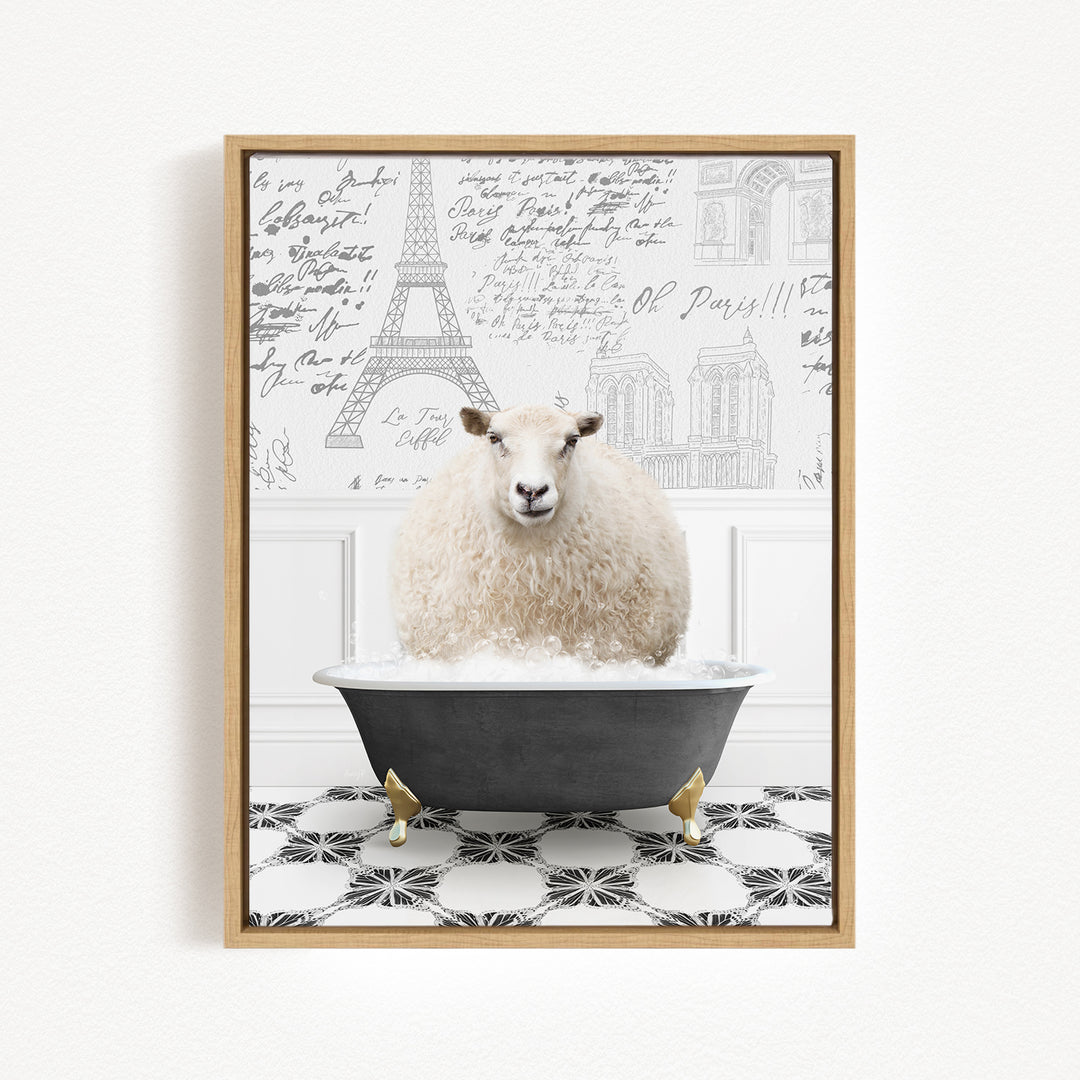 A fluffy white sheep sits in a bathtub filled with bubbles, surrounded by a black and white checkered floor and a wall with the Eiffel Tower and other Parisian landmarks.
