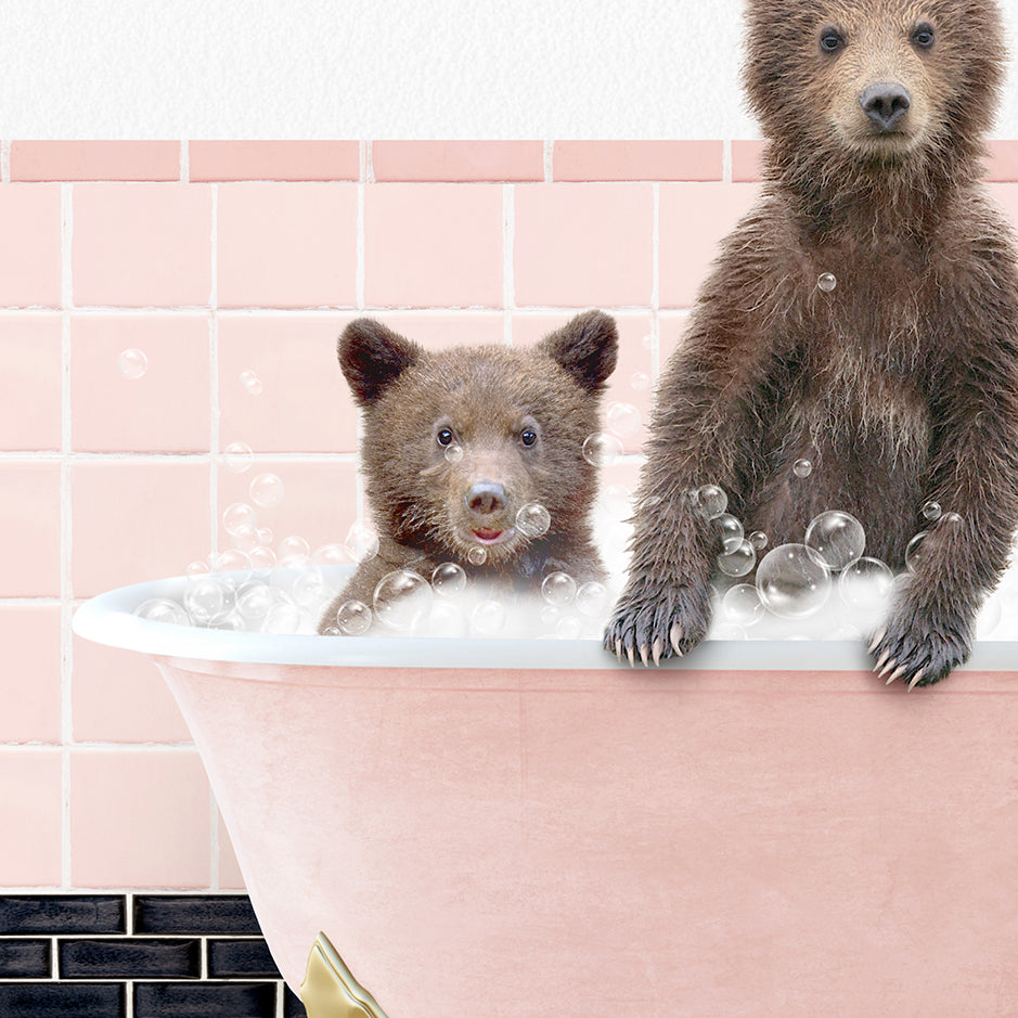 two brown bears are sitting in a bathtub