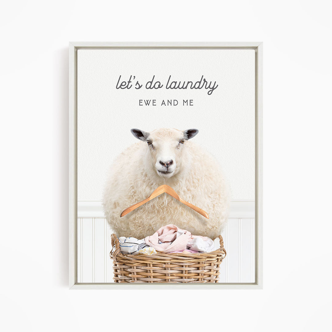 A sheep sitting in a wicker basket filled with laundry, with the text "let's do laundry EWE AND ME" displayed above the image.
