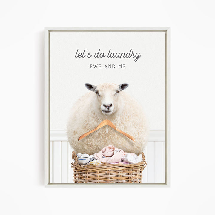 A sheep sitting in a wicker basket filled with laundry, with the text "let's do laundry EWE AND ME" displayed above the image.