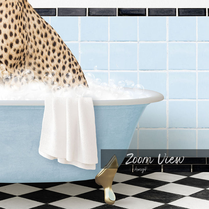 A leopard-print cat is sitting in a blue bathtub filled with water, with a towel draped over its back.