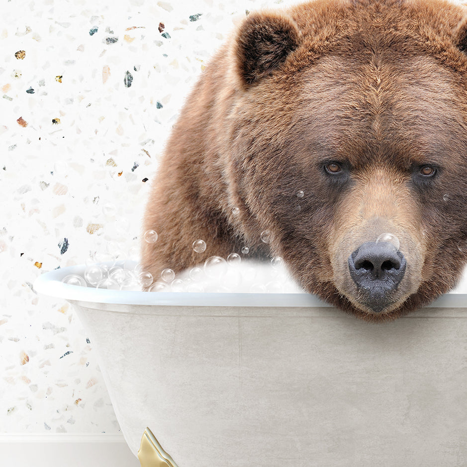 a large brown bear sitting in a bath tub