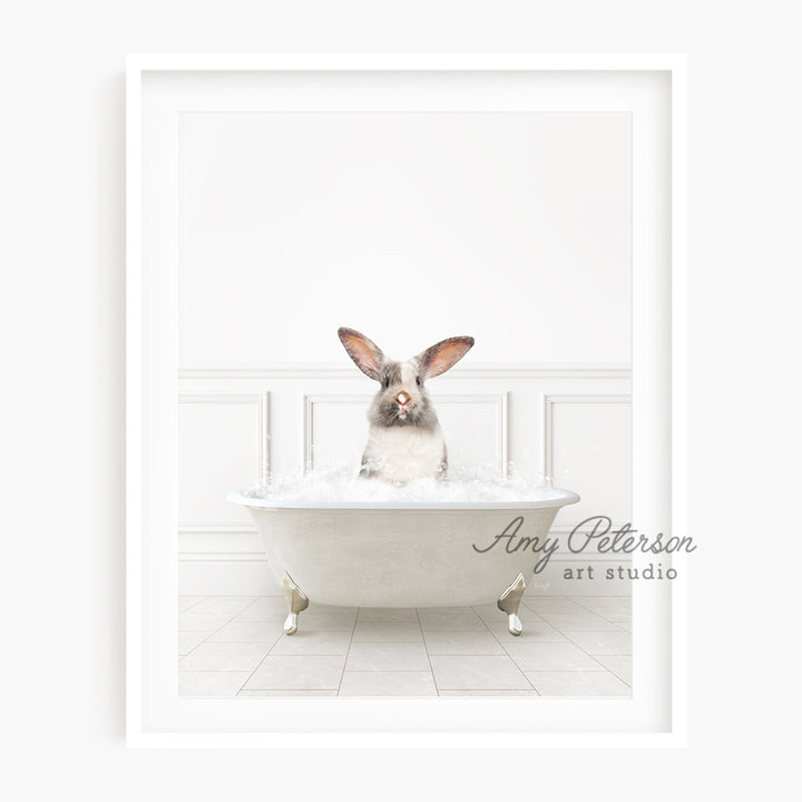 a rabbit sitting in a bathtub with a white wall behind it