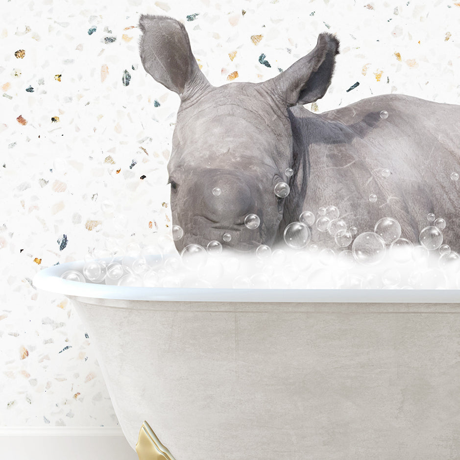 a rhino is taking a bath in a bathtub