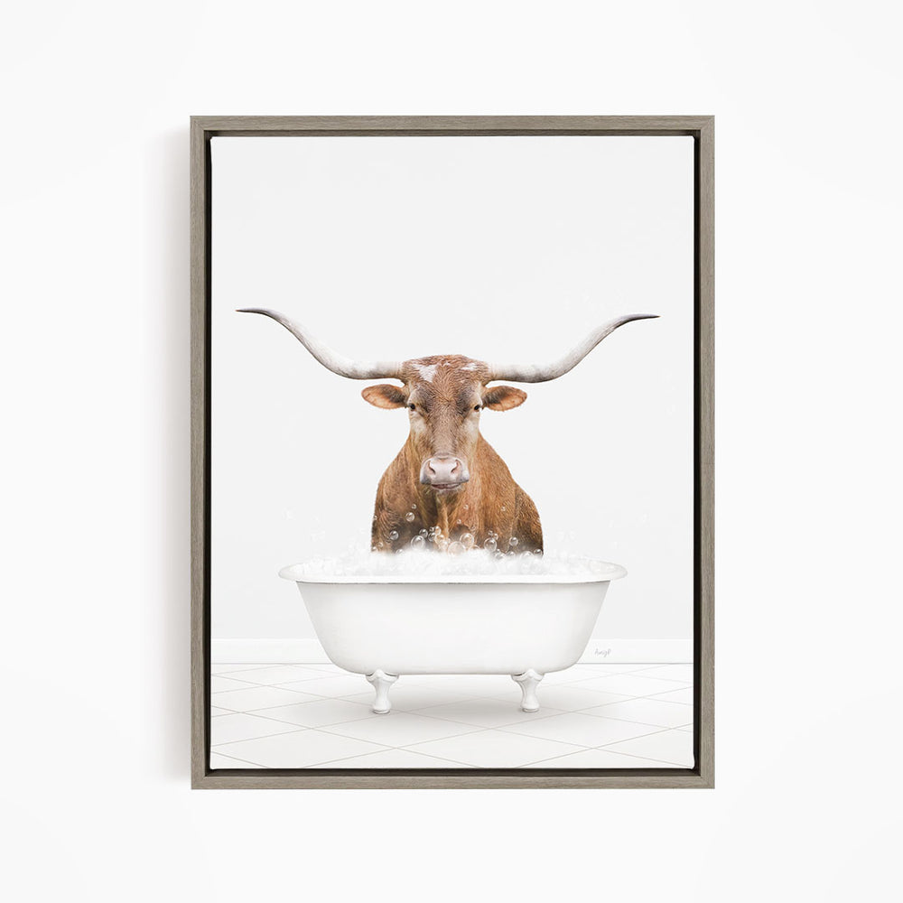 A brown steer with long horns is standing in a white bathtub filled with water, creating a whimsical and humorous scene.