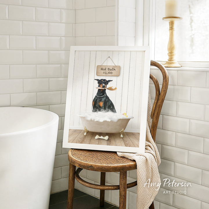 A framed image of a dog sitting in a bathtub, with a sign above it that says "Hot Bath $1.00".