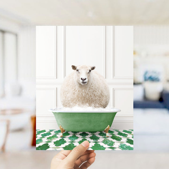 A fluffy white sheep sits in a green bathtub filled with bubbles, surrounded by a patterned green and white floor.