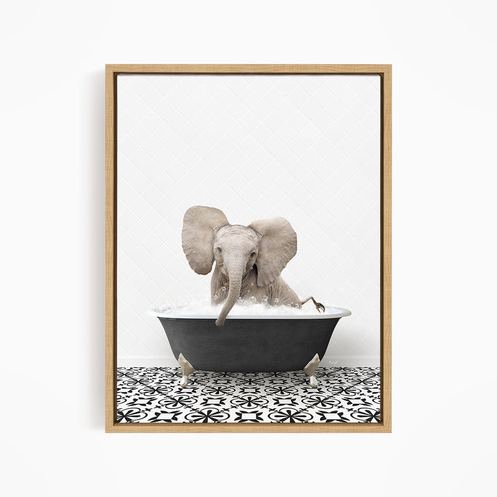 A gray elephant is sitting in a black bathtub filled with water, creating a whimsical and playful scene.