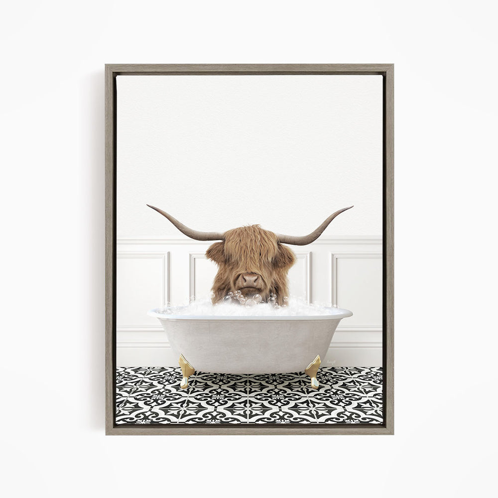 A Highland cow with large horns is sitting in a white bathtub filled with water, creating a whimsical and playful scene.
