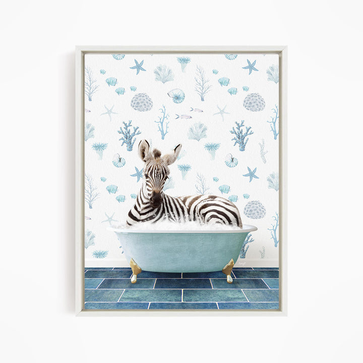 A zebra is sitting in a blue bathtub, surrounded by a pattern of seashells and starfish on the wall behind it.