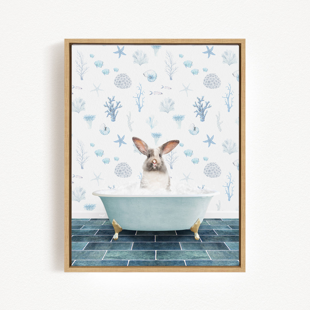 A rabbit sitting in a bathtub filled with bubbles, surrounded by a blue and white ocean-themed wallpaper.