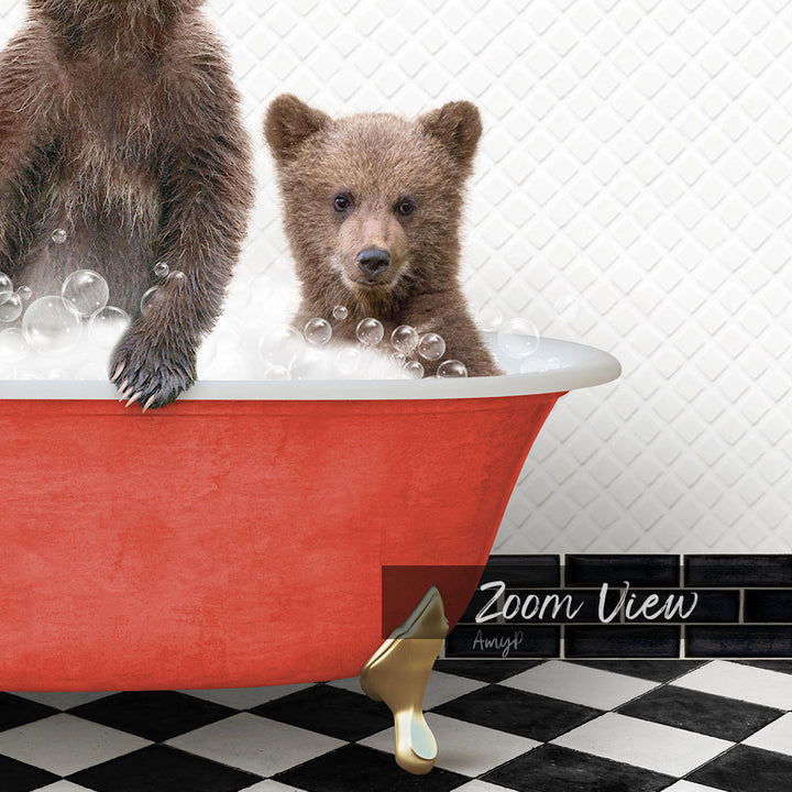 A red bathtub filled with bubbles, with a small brown bear sitting inside and looking at the camera.