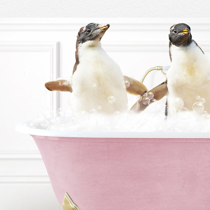 two penguins sitting in a bathtub with bubbles