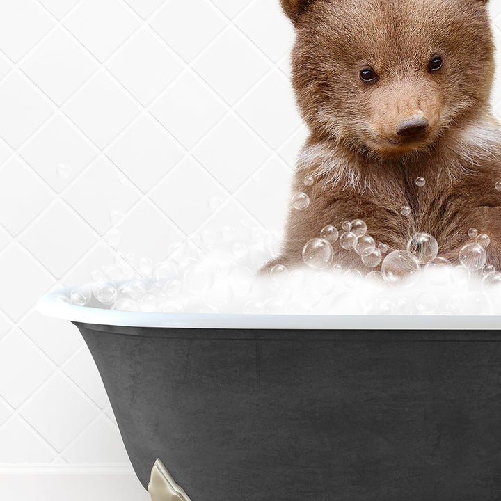 a brown bear sitting in a bath tub filled with bubbles