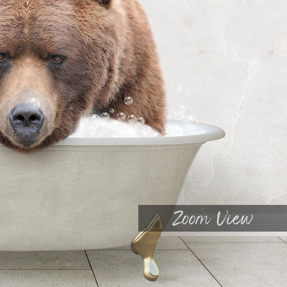 A large brown bear is sitting in a bathtub filled with bubbles, appearing to enjoy a relaxing bath.