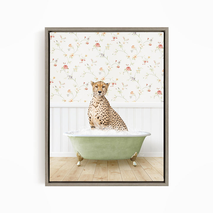 A cheetah sitting in a green bathtub filled with water, with a floral wallpaper in the background.