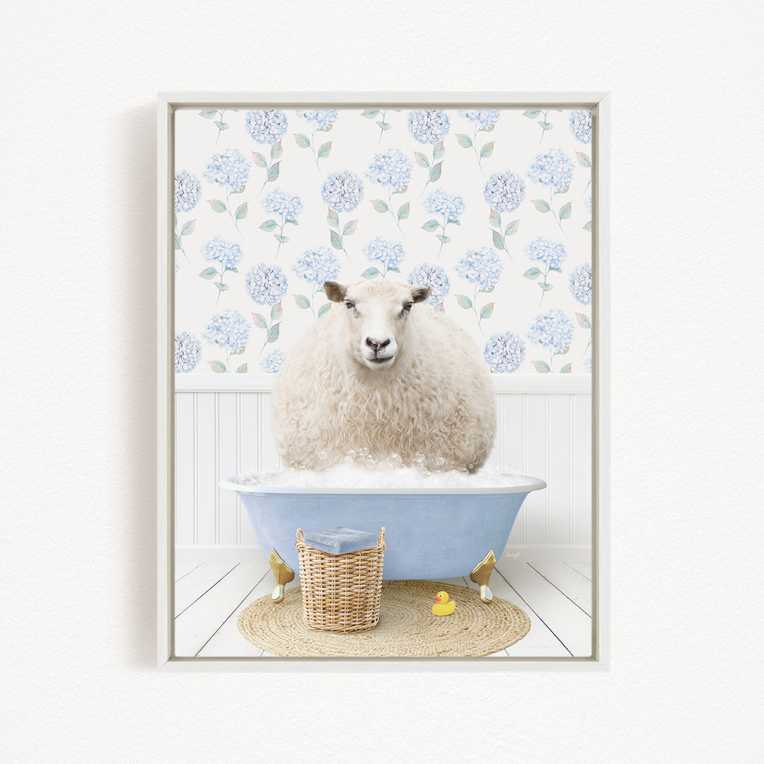 A fluffy white sheep sits in a blue bathtub filled with bubbles, surrounded by a wicker basket and a yellow rubber duck.