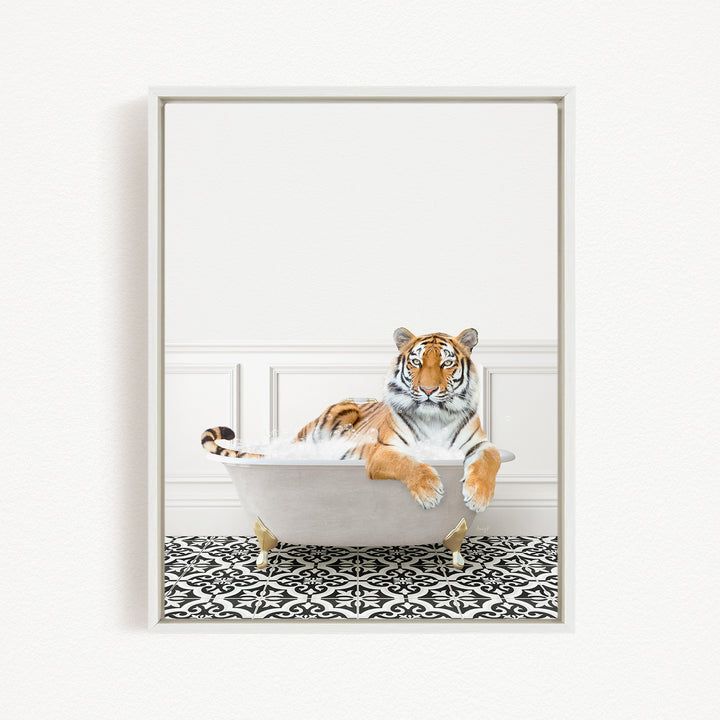 A tiger is sitting in a white bathtub filled with water, surrounded by a black and white patterned floor.