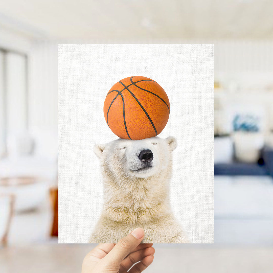A polar bear balancing a basketball on its head.
