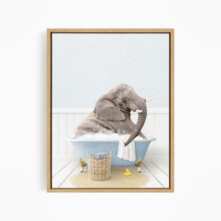 A gray elephant is sitting in a blue bathtub filled with water, surrounded by yellow rubber ducks.