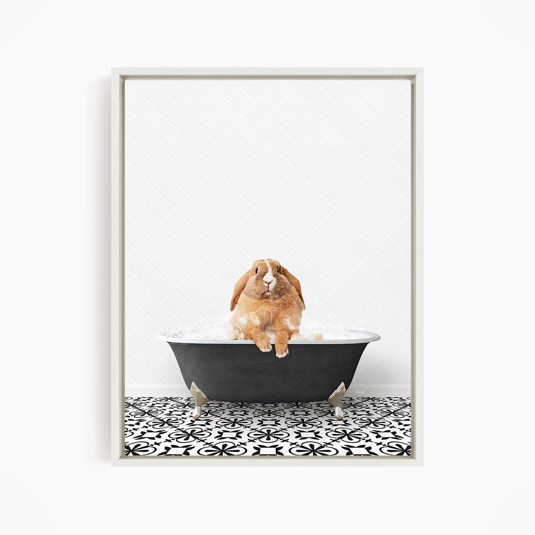 A brown rabbit sitting in a black bathtub filled with water, surrounded by a black and white patterned floor.